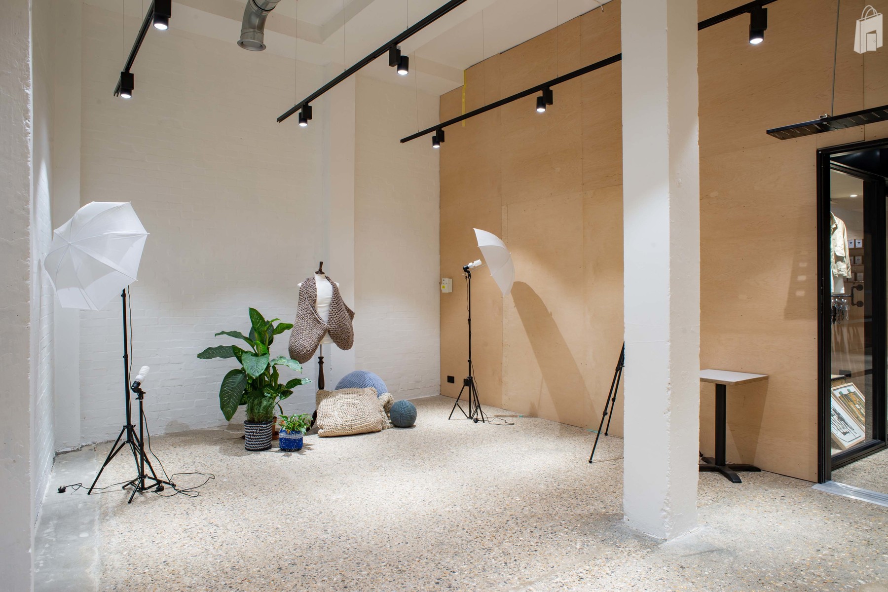 Exposed brick and plywood walls