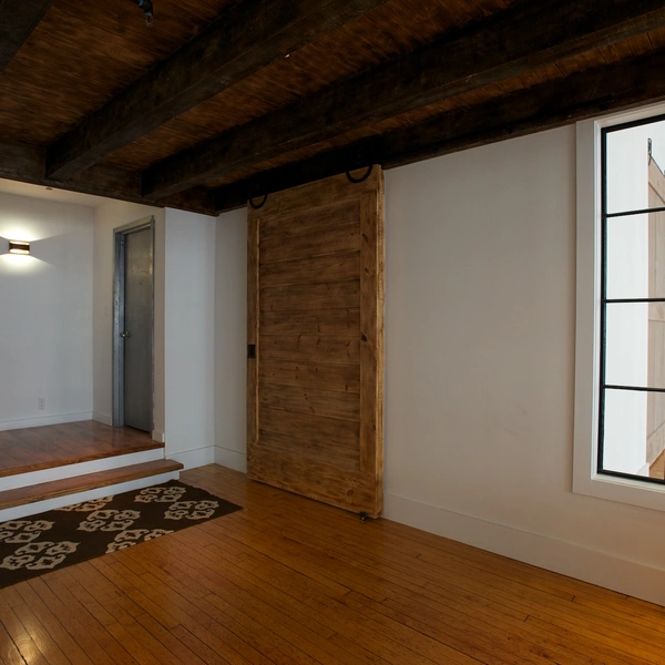 White Wall Loft Space with Original Tin Ceiling