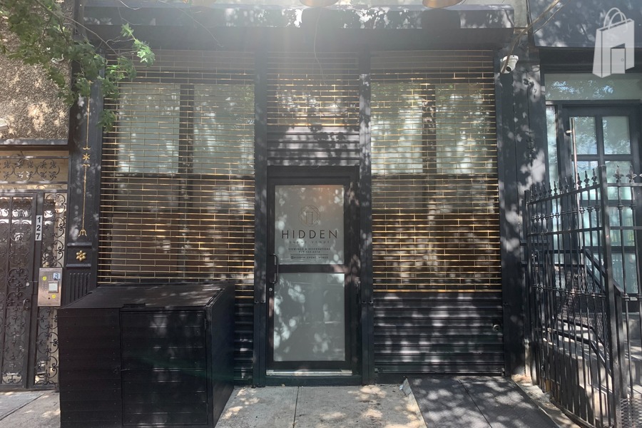 Our Quaint entrance, dressed in matte black with a gold finish, gates can be pulled up for a more visible presence