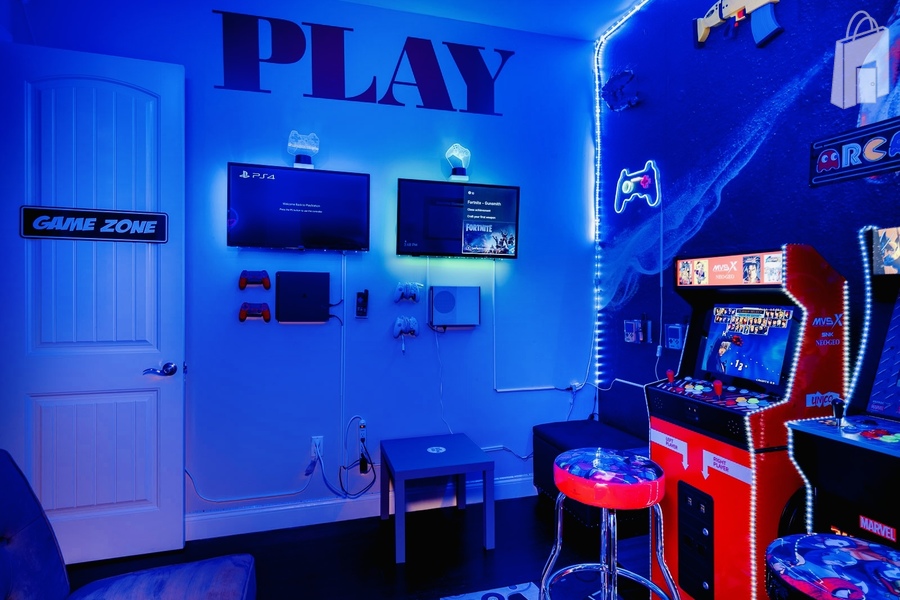 The Game Zone: a cool blue room with video games, arcades and handhelds