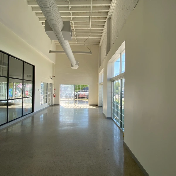 Open concept corner unit space with natural light and high ceilings