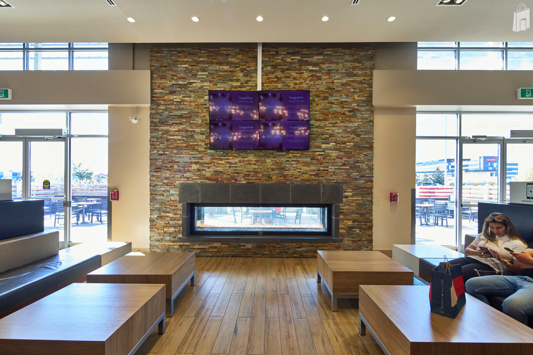 Equipped with TV screens displaying a collection of ads and television programming. 