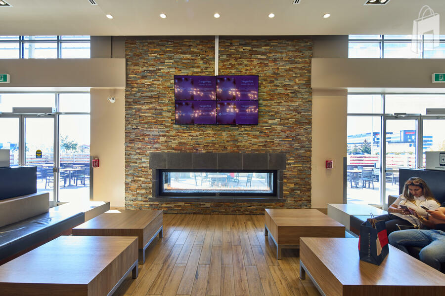 Equipped with TV screens displaying a collection of ads and television programming. 