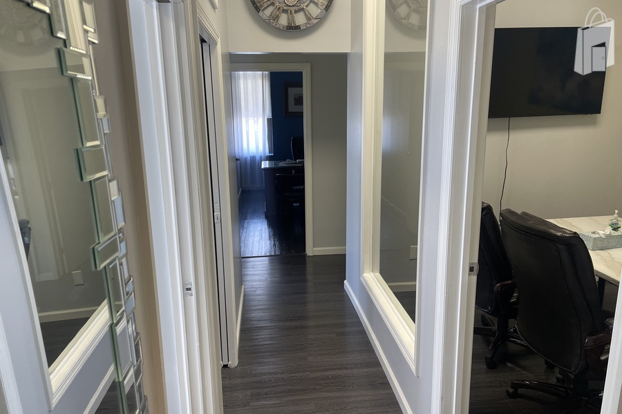 Bright Hallway with Glass Walls - Versatile Office Space in Astoria, Queens for Meetings or Filming
