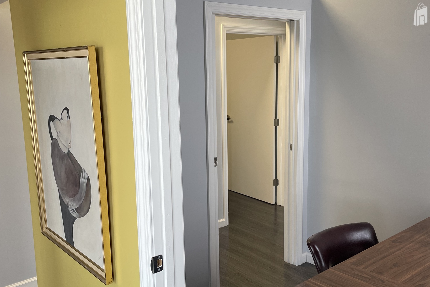 Vibrant Entryway with Modern Art and Clean Architectural Lines - Astoria Office