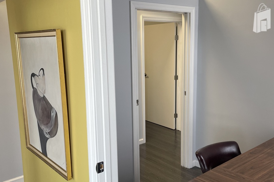 Vibrant Entryway with Modern Art and Clean Architectural Lines - Astoria Office